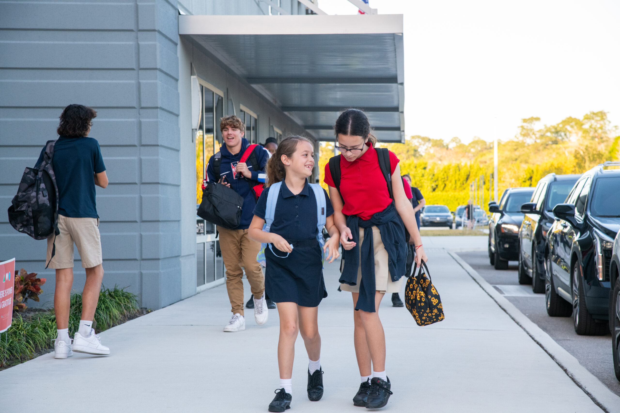 Two young girls walking and talking