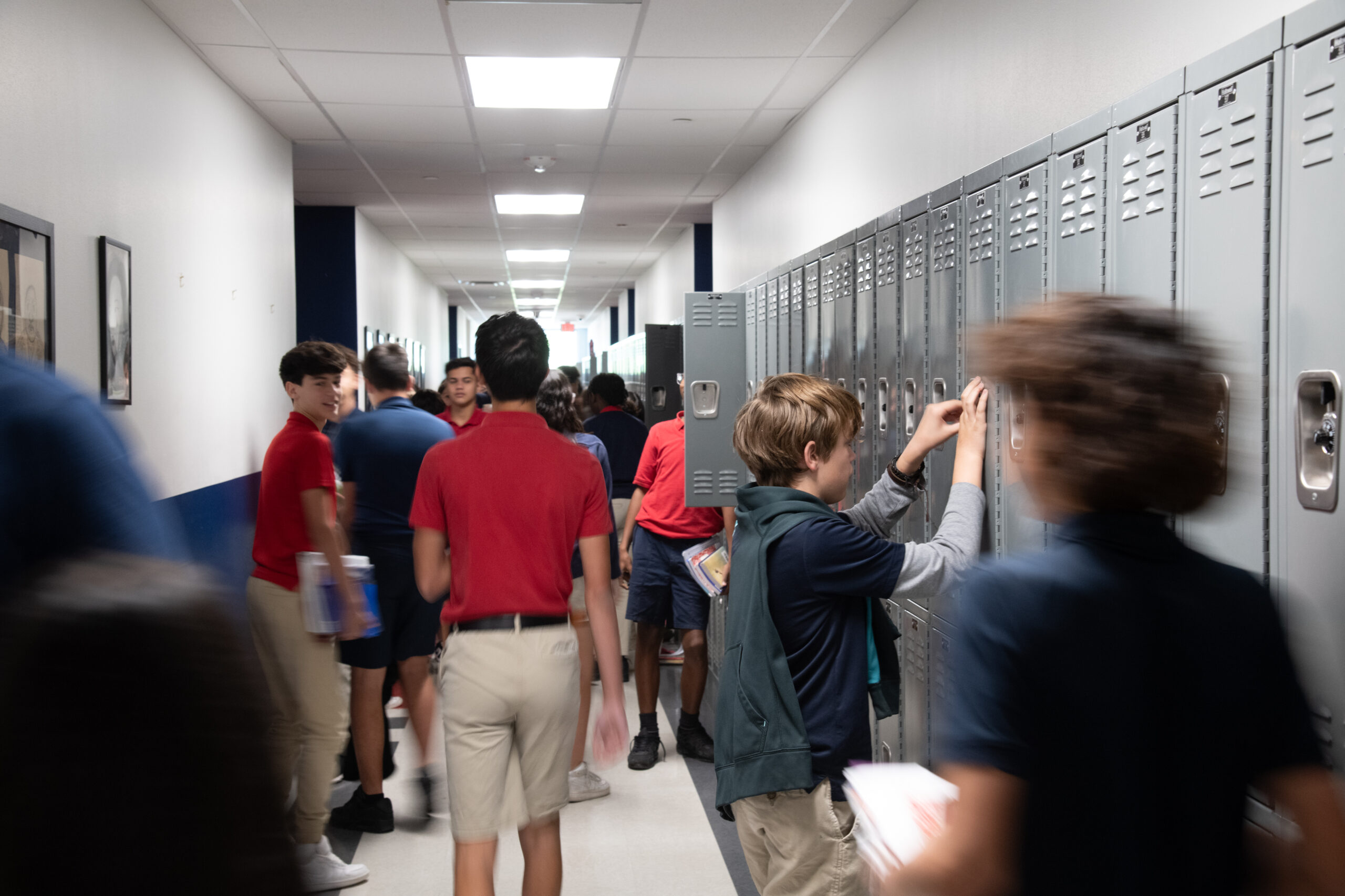 students at lockers in the hallway