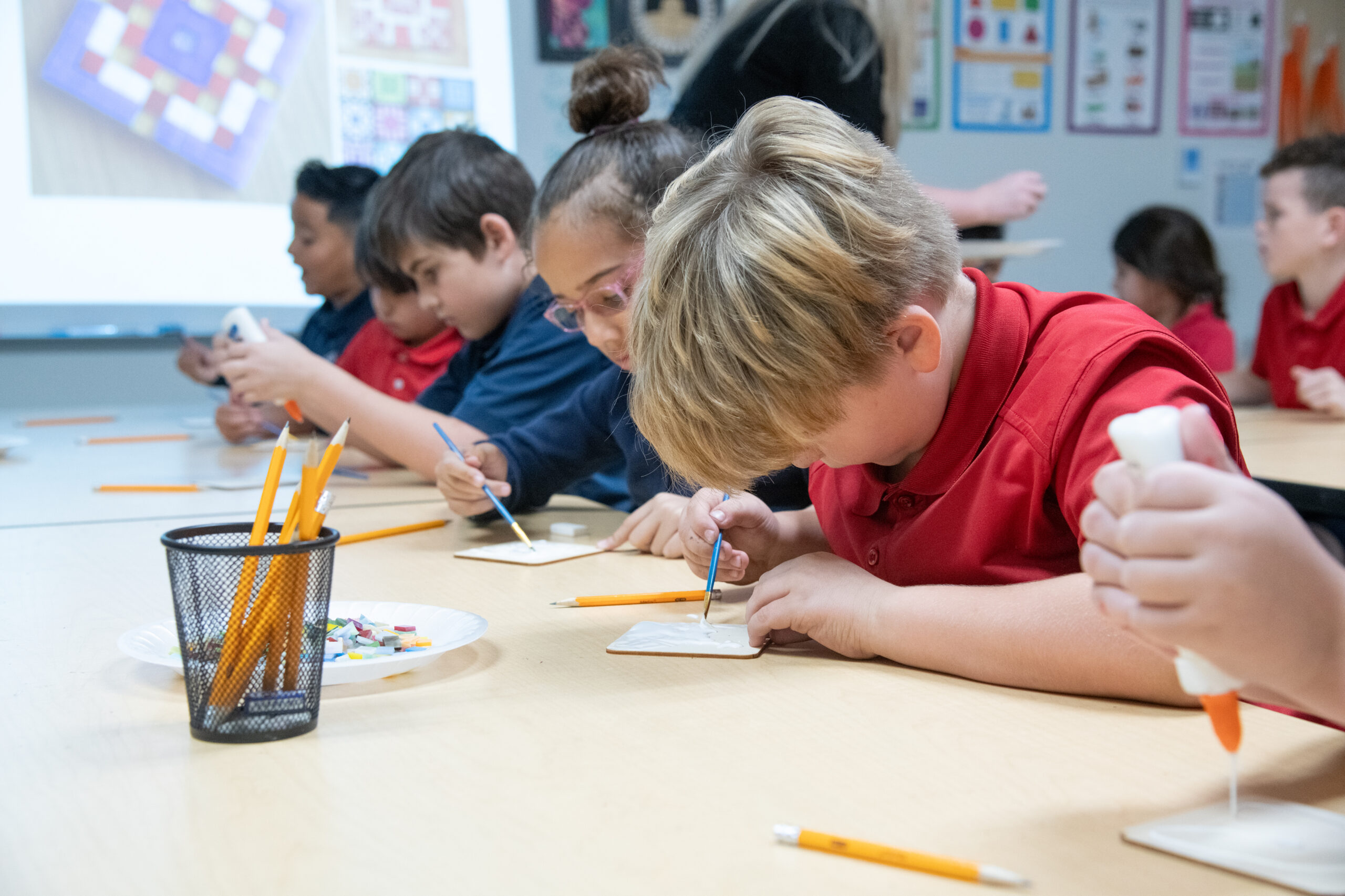 young boy charter school taking a test